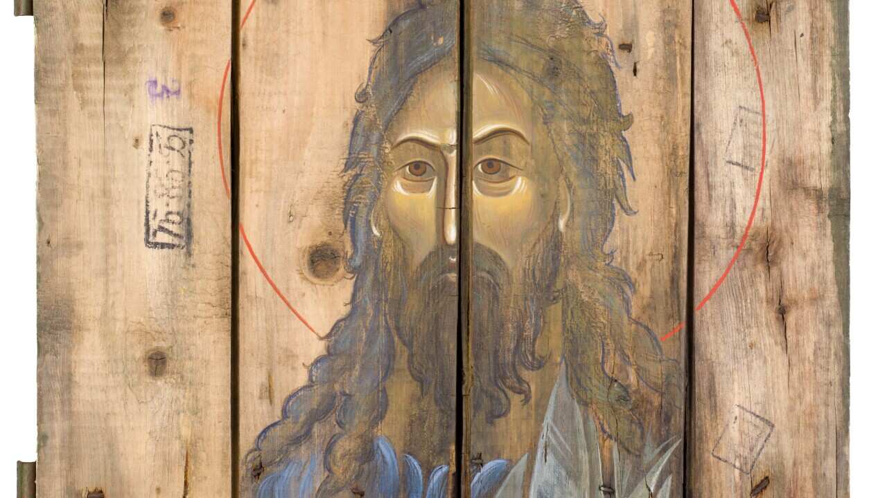 An icon painted on wooden planks from ammunition boxes by O.Klimenko and S.Atlantova