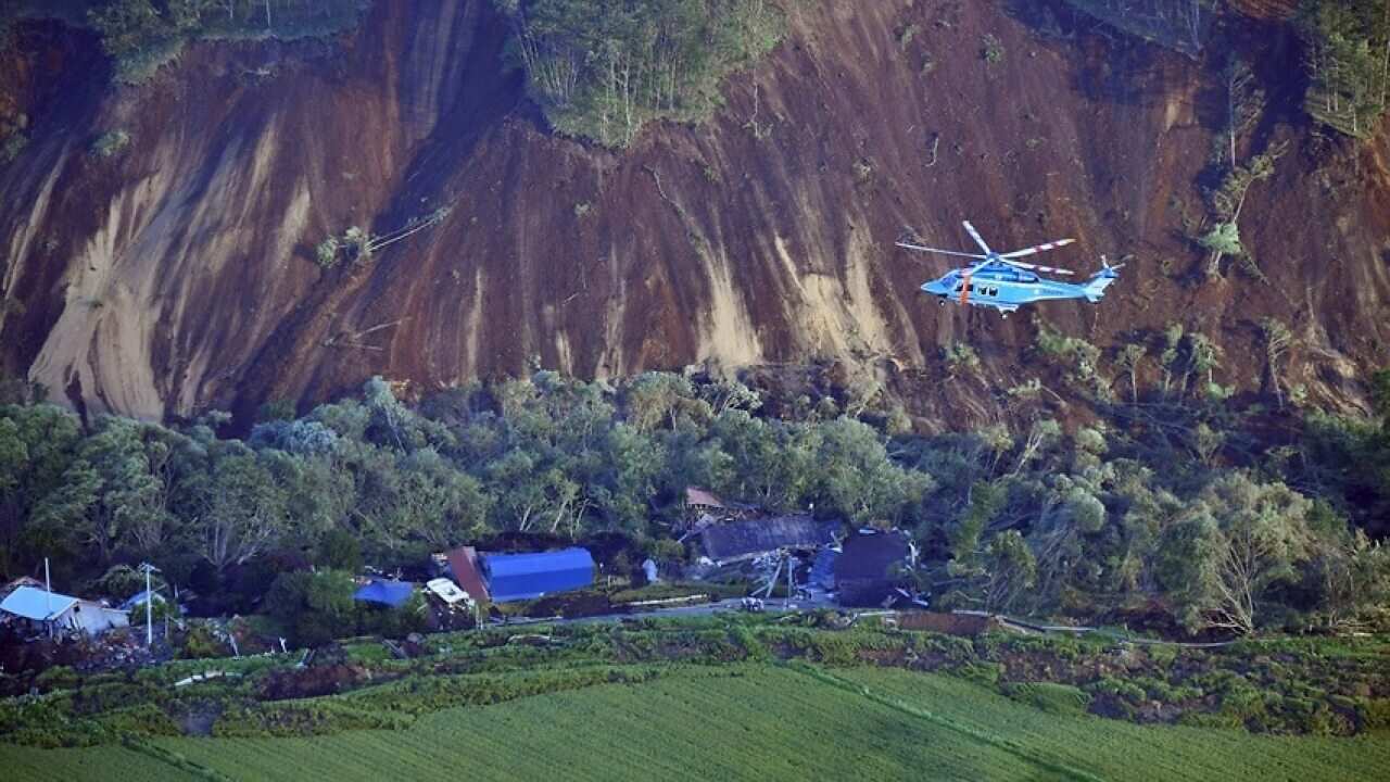 An aerial photo shows landslides that seem to be happened by the earthquake in Atsuma Town, Hokkaido on Sep.6, 2018. 