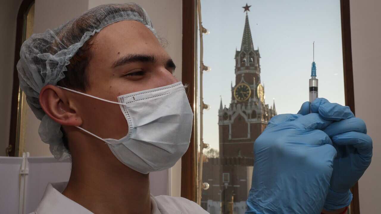 A nurse prepares a syringe with a dose of Russia's Sputnik V COVID-19 vaccine 