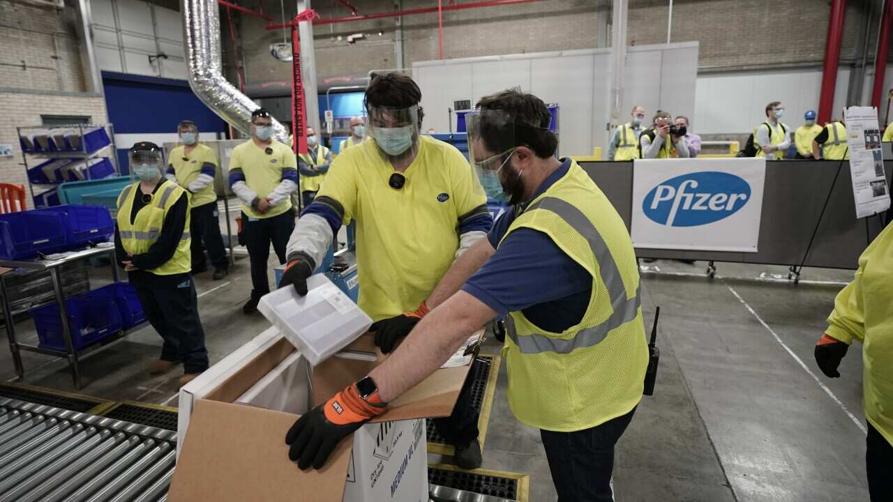 Boxes containing the Pfizer-BioNTech COVID-19 vaccine are prepared to be shipped at the Pfizer Global Supply Kalamazoo manufacturing plant in Michigan.