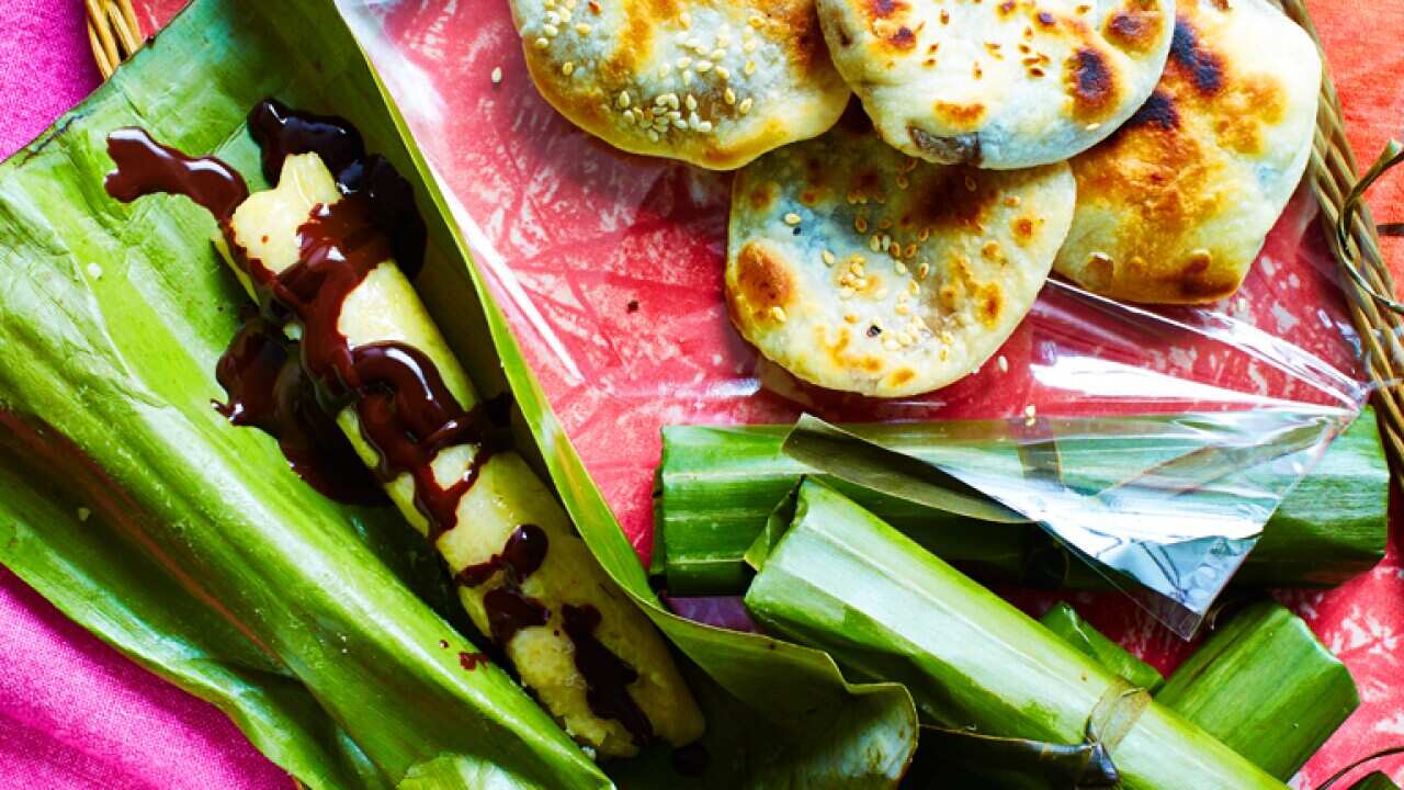 Steamed millet cakes with chocolate sauce (budbud kabog)