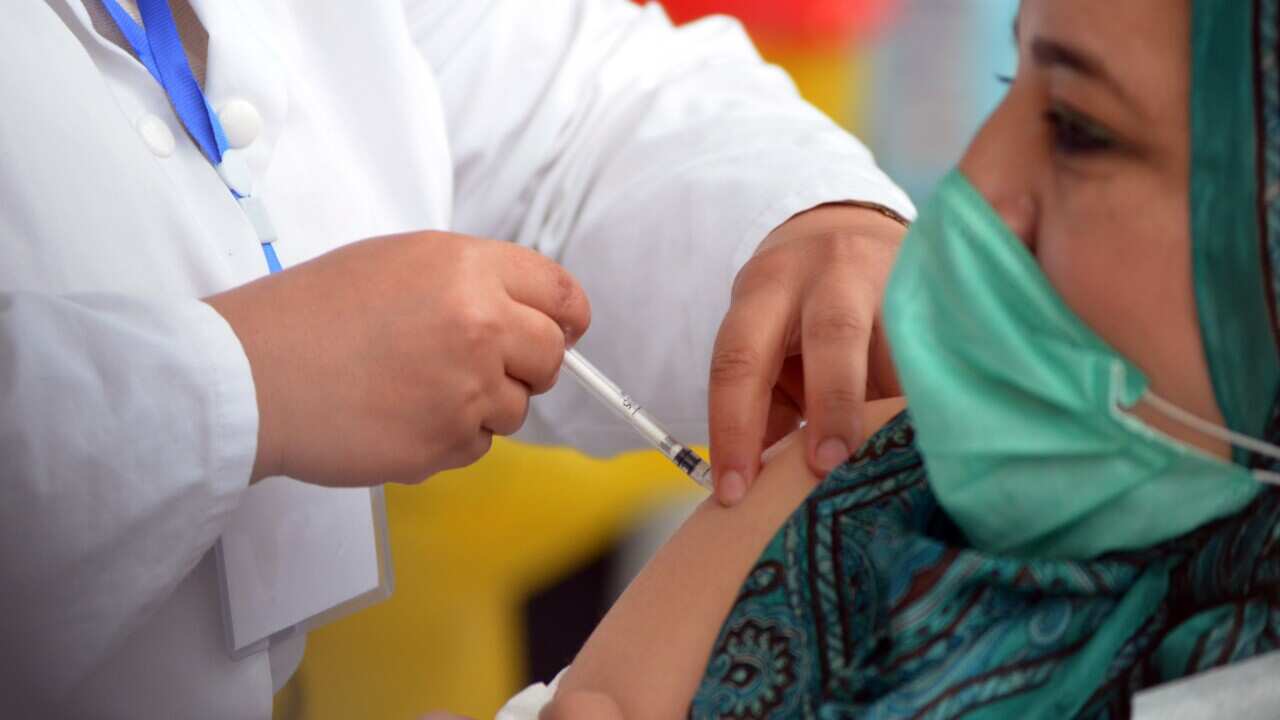 A woman getting a vaccine