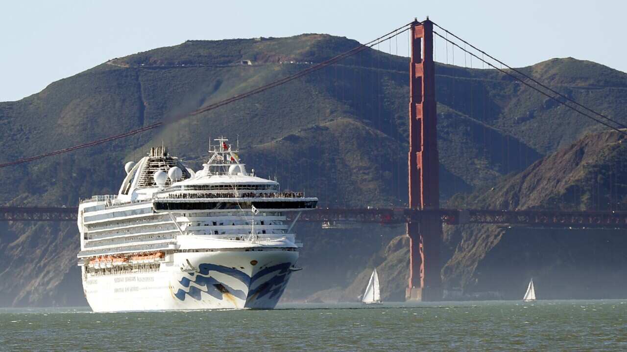 The Grand Princess cruise ship passes the Golden Gate Bridge as it arrives from Hawaii in San Francisco