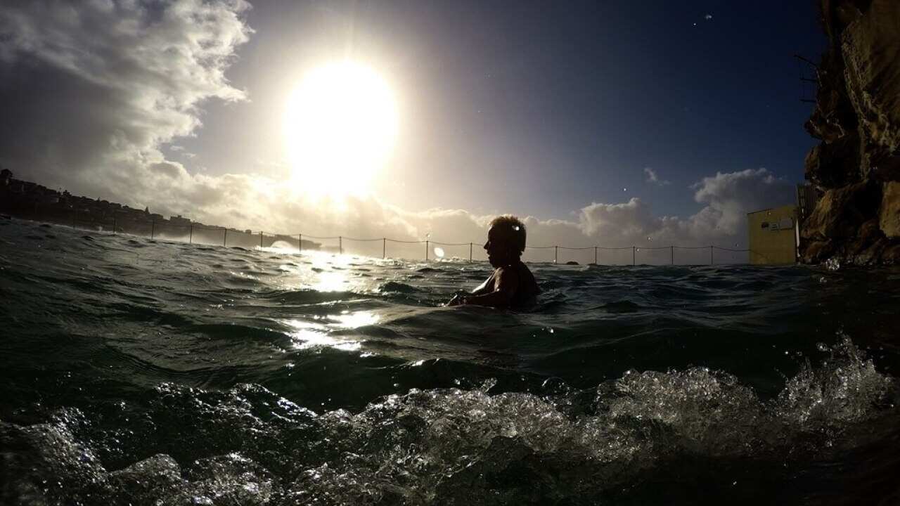 A swimmer takes to the water at Bronte Baths in Sydney