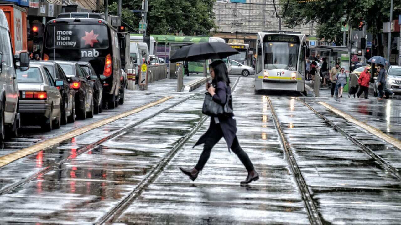 People walk in the rain in Melbourne