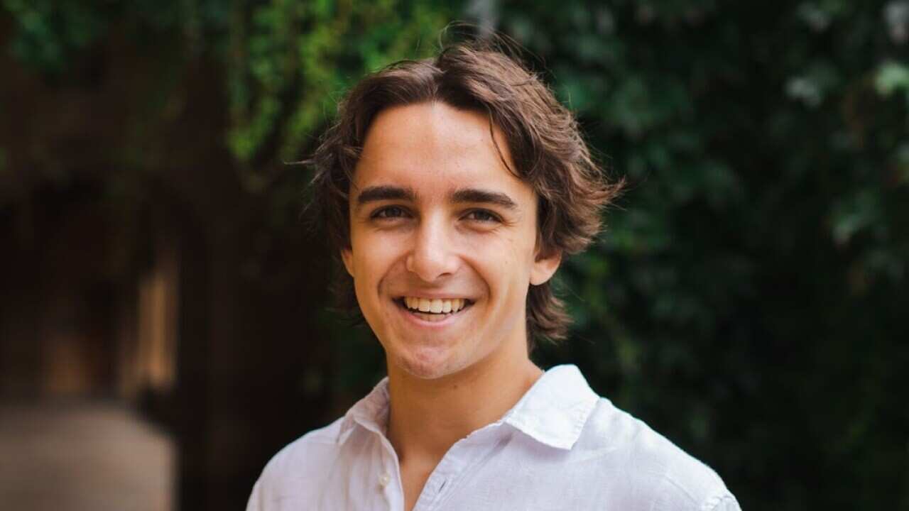 A man in a white linen shirt. 