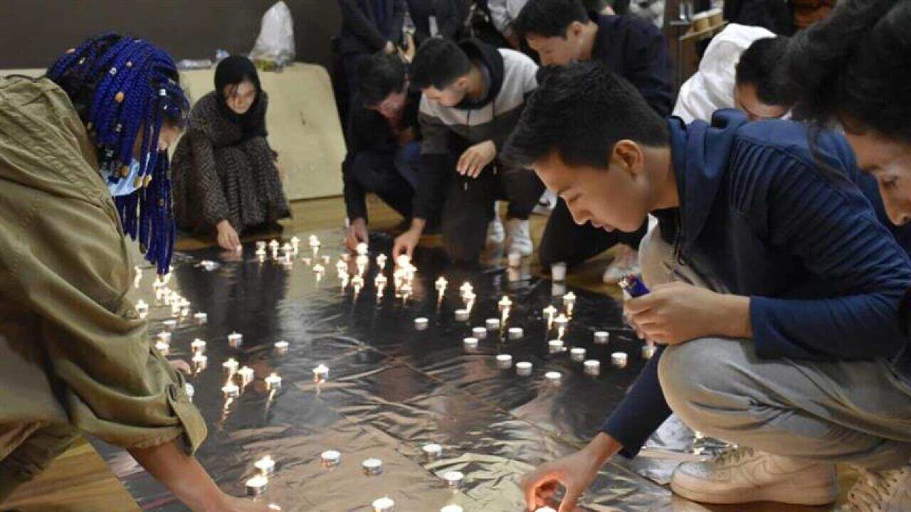 Candlelight vigils were held in Sydney and Melbourne to remember those killed in recent terror attacks in Afghanistan