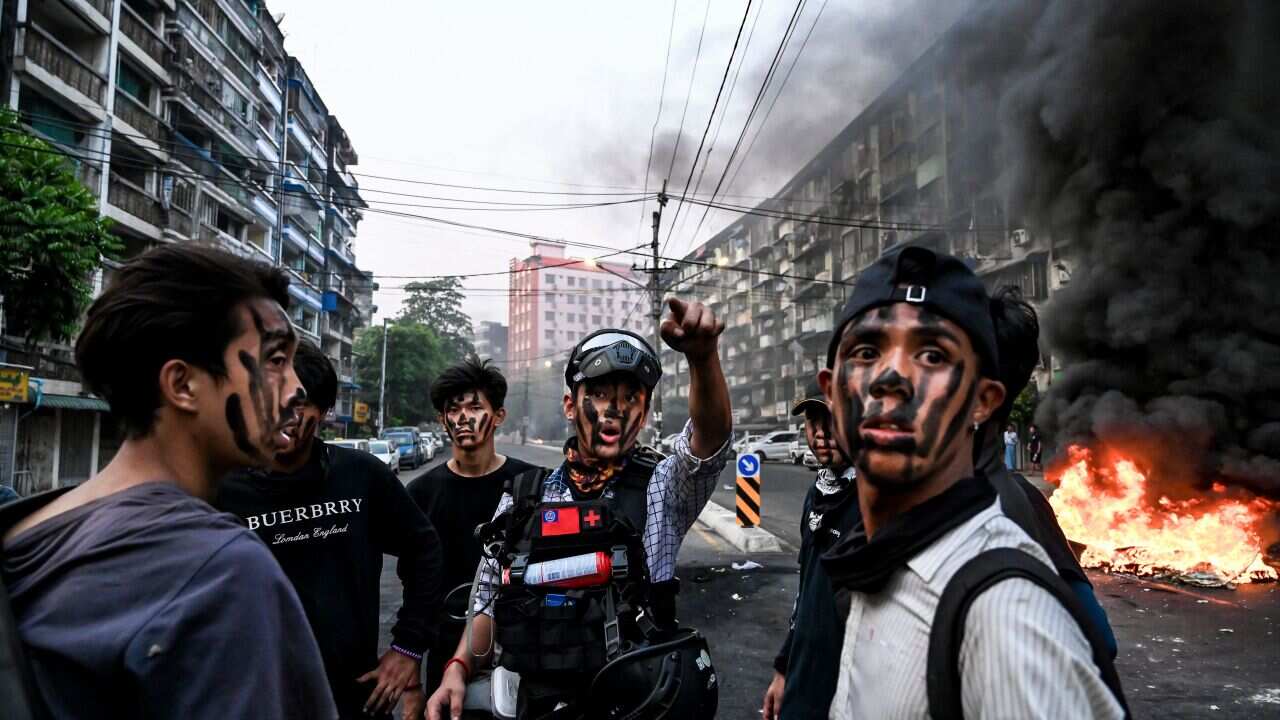 Protesters with their faces painted during a protest against the military coup, in Yangon.