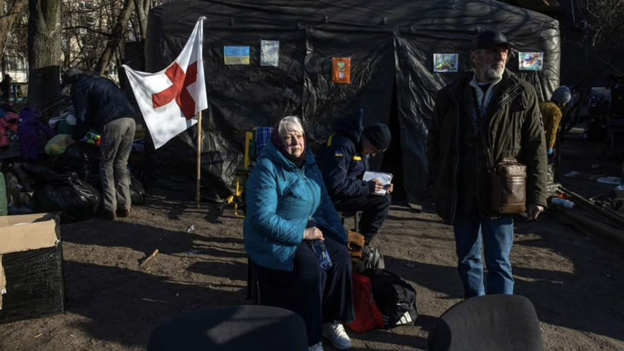 Tetyana and Volodymyr wait at a camp after they were evacuated from Irpin town in northern Ukraine.