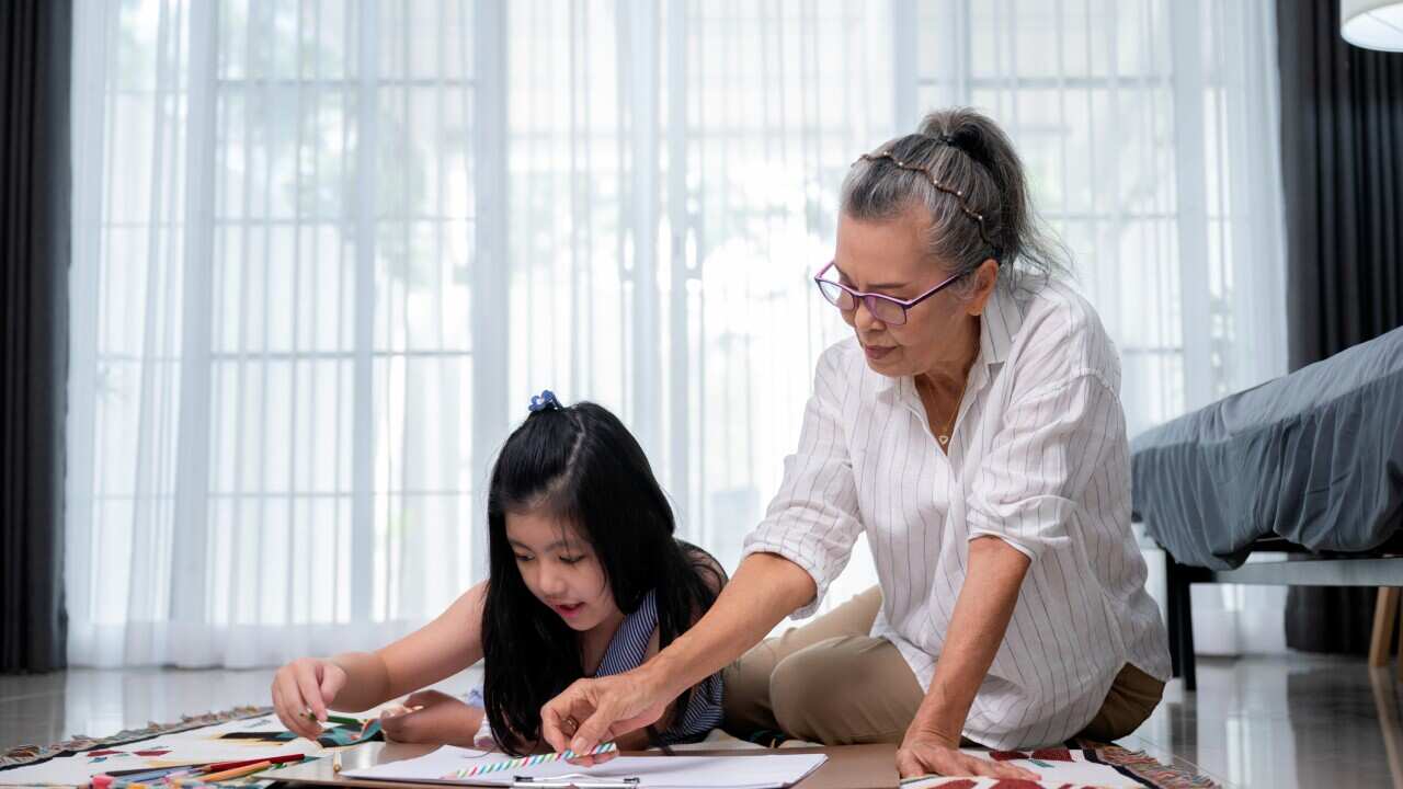 grandmother and granddaughter together at home