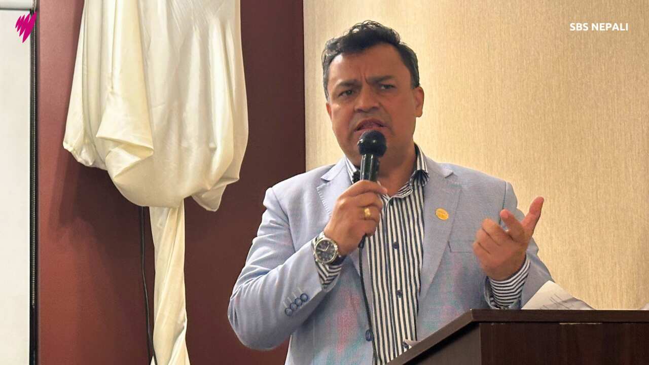 Non-Resident Nepali Association's International Coordination Council (NRNA ICC) president Badri K.C. (R) speaking at the community program organised by NRNA Victoria in Melbourne on Thursday, 19 September 2024.