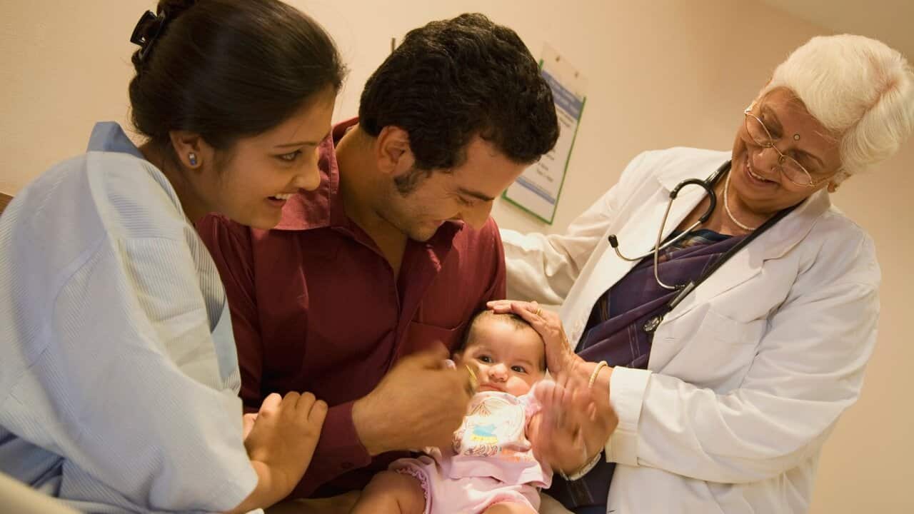 Couple with their child