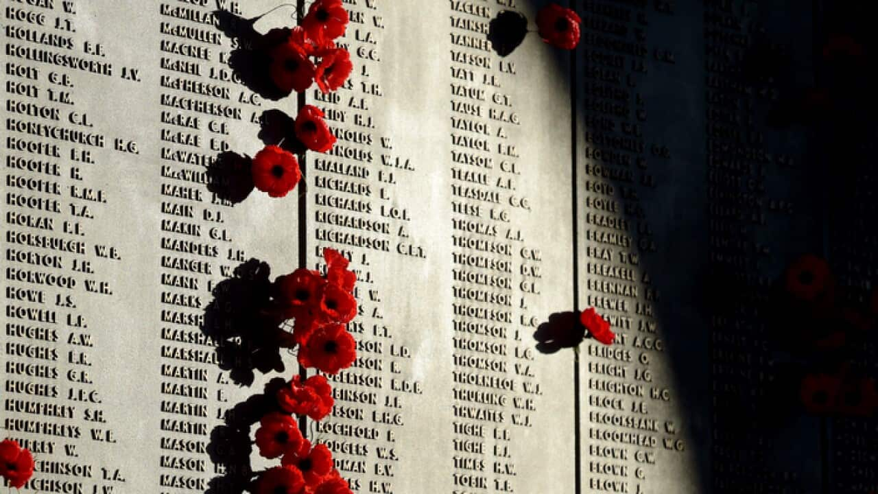 Poppies are seen at the Roll of Honour at the Australian War Memorial after the ANZAC Day dawn service in Canberra, Saturday, April 25, 2015.