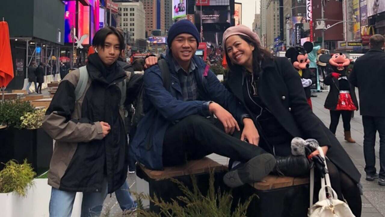 Quyen Le and her sons in a trip