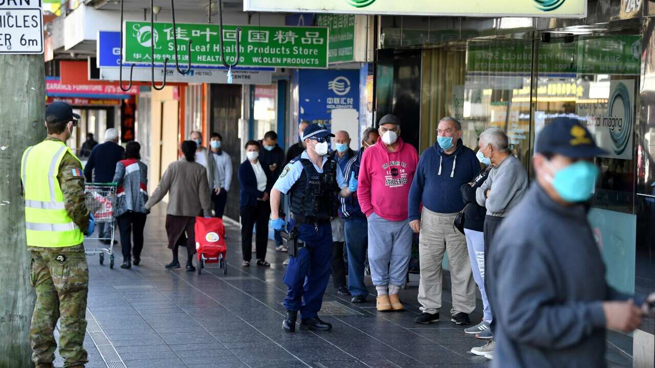 NSW Police and Defence Force members on a compliance patrol at Campsie in Sydney, Thursday, August 19, 2021. NSW is racing to vaccinate as many people as quickly as it can as the daily COVID-19 case numbers spiral higher despite nearly eight weeks of lock