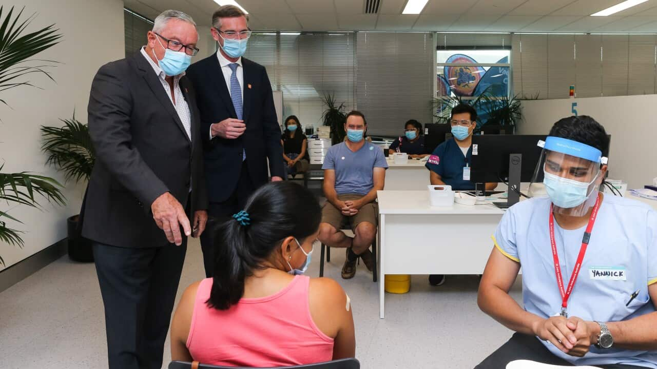 NSW Premier Dominic Perrottet and Minister for Health Brad Hazzard during a visit to Homebush vaccination hub, in Sydney, Sunday, February 6, 2022 (AAP Image/Pool, Gaye Gerard ) NO ARCHIVING