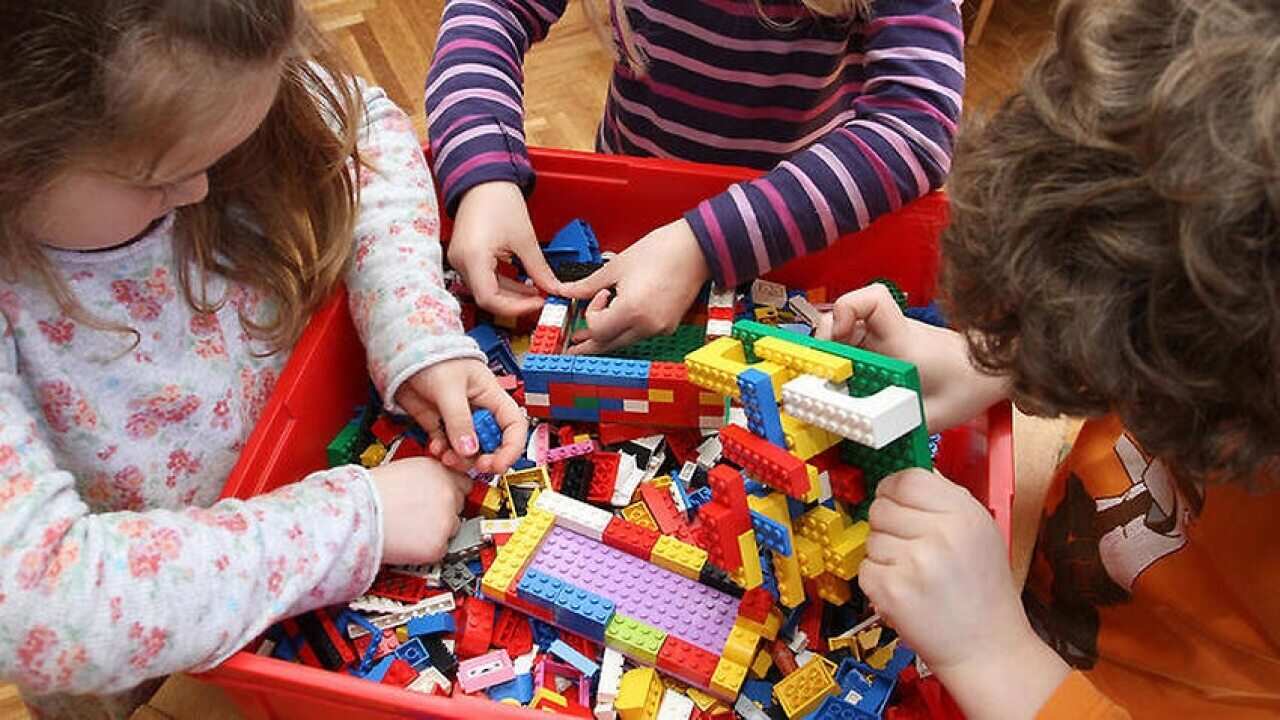 Children playing with LEGO building bricks