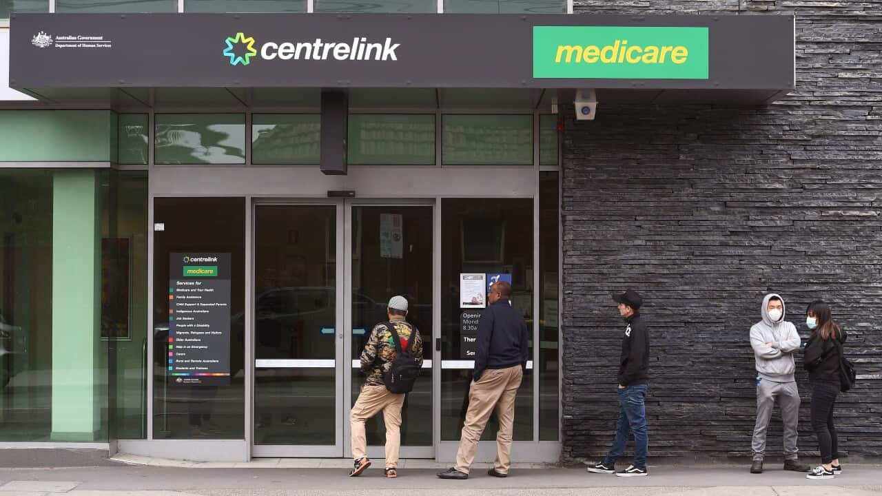People queuing outside a Centrelink office
