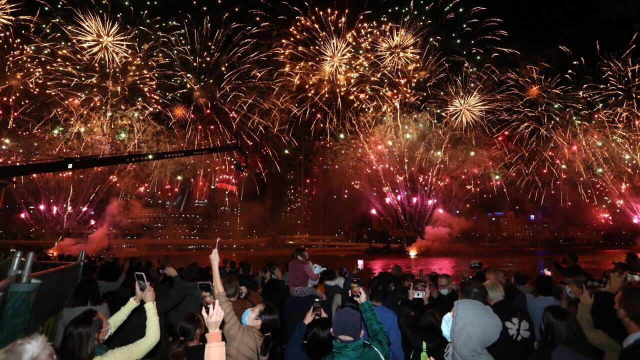 People celebrate in Brisbane after the International Olympic Committee voted to confirm the city will host the 2032 Summer Olympics, on 21 July, 2021.