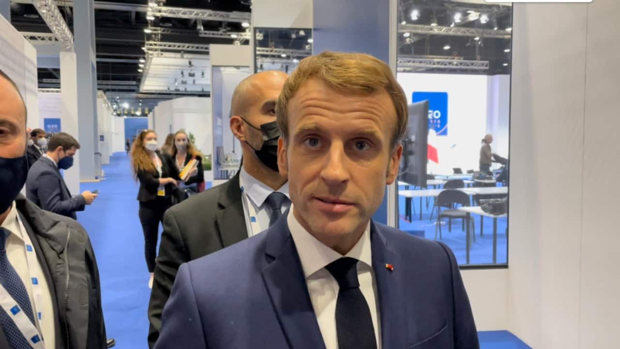 French President Emmanuel Macron speaks to reporters.