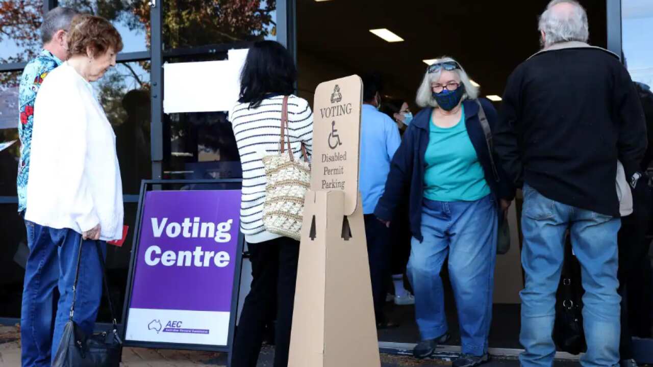 Voters queue outside an Australian Electoral Commission early voting centre in Willetton in the Federal electorate of Tangney in Perth, Tuesday, 17 May, 2022. 