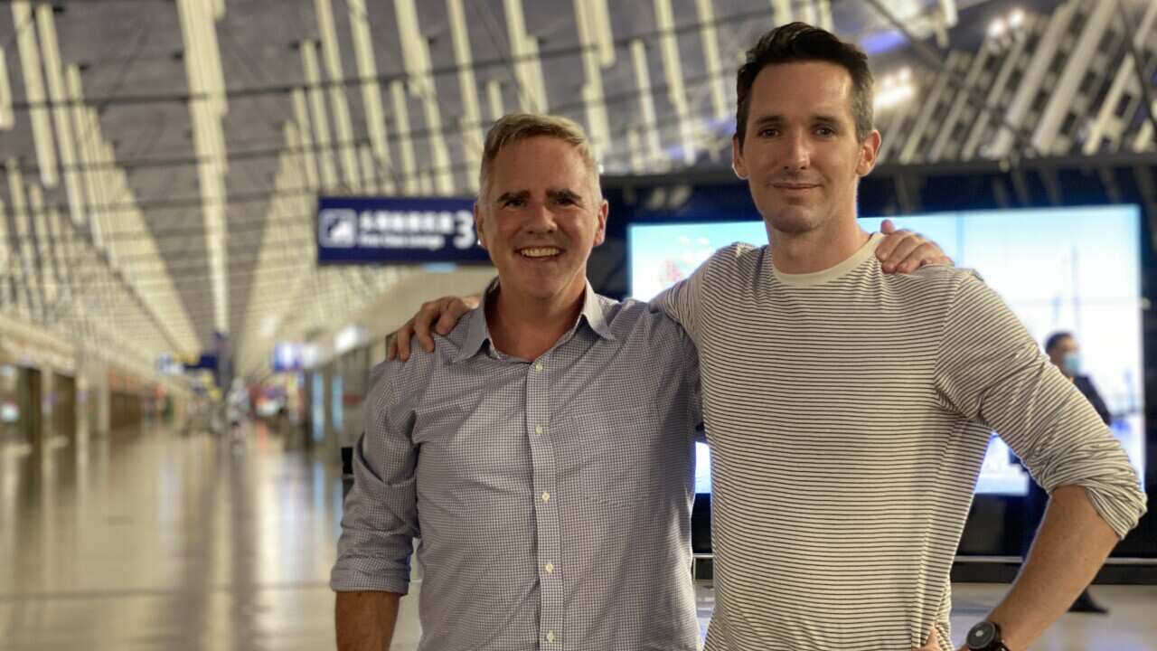  Bill Birtles from the ABC (right) and Michael Smith from the Australian Financial Review were evacuated overnight after a diplomatic stand-off. 