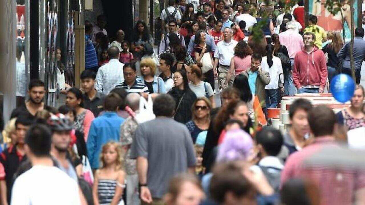 Huge crowds fill Pitt Street Mall and the CBD shopping district as they purchase their last minute christmas gifts on Christmas Eve in Sydney, Wednesday, Dec. 24, 2014. (AAP Image/Dean Lewins) NO ARCHIVING