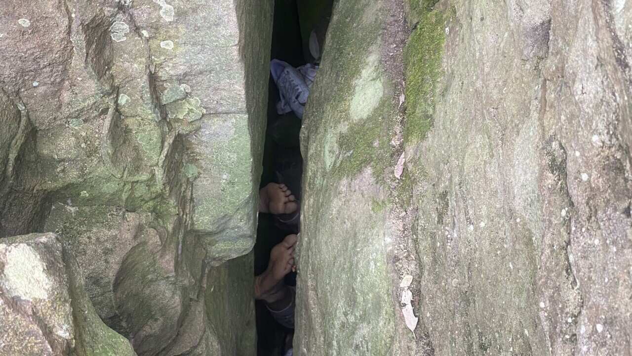 BETWEEN A ROCK AND A HARD PLACE