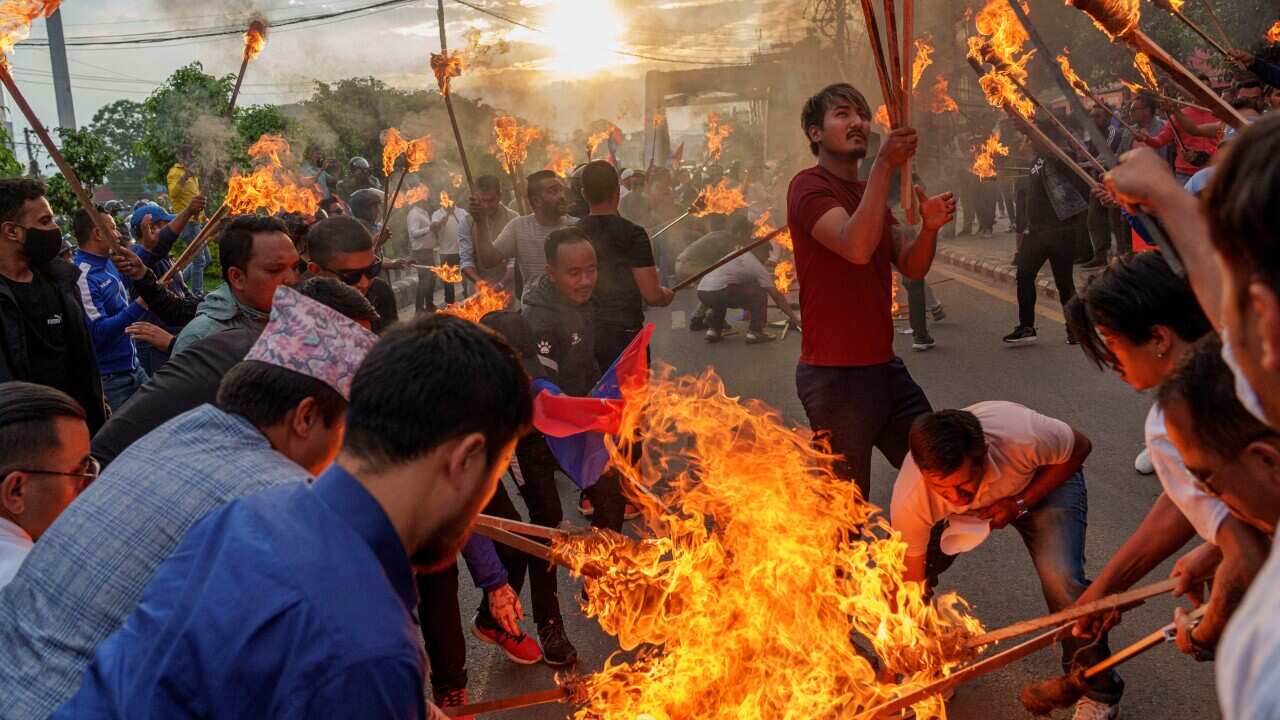 Student activists participate in a torch rally against price hike in petroleum products in Kathmandu, Nepal, Thursday, June 23, 2022.