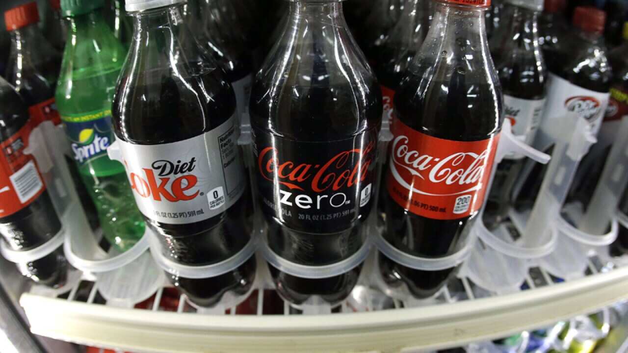 A shelf of soft drinks