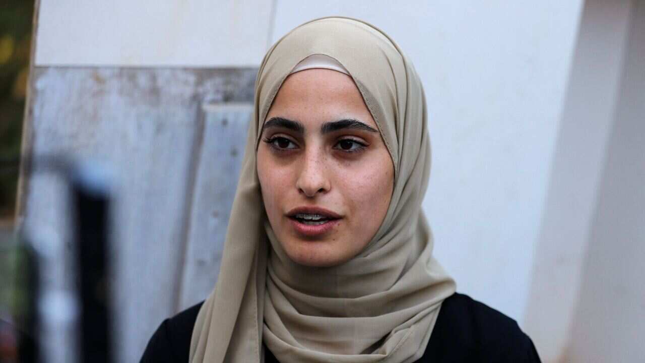 Palestinian activist Muna el-Kurd talks to reporters  after being released from an Israeli police station, on 6 June, 2021.