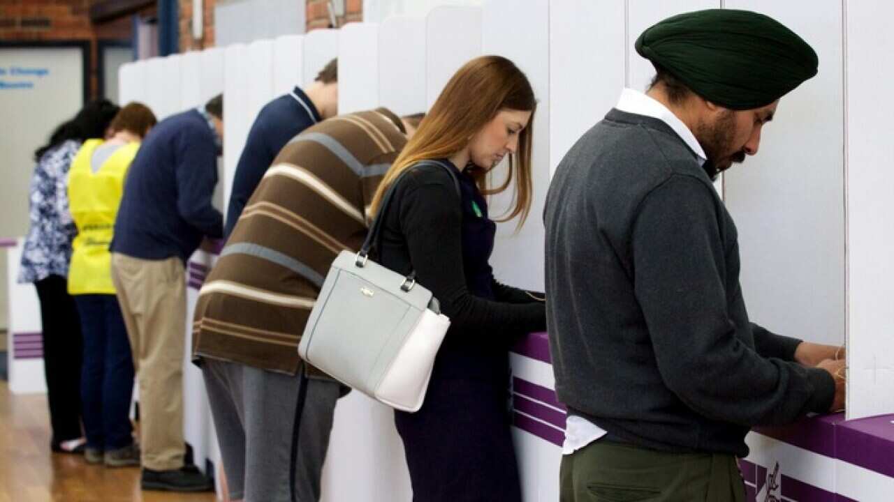 Members of the public casting their vote at Kelmscott Senior High School on election day of the Canning by election in Kelmscott, Western Australia on Saturday Sept. 19, 2015. (AAP Image/Richard Wainwright) NO ARCHIVING