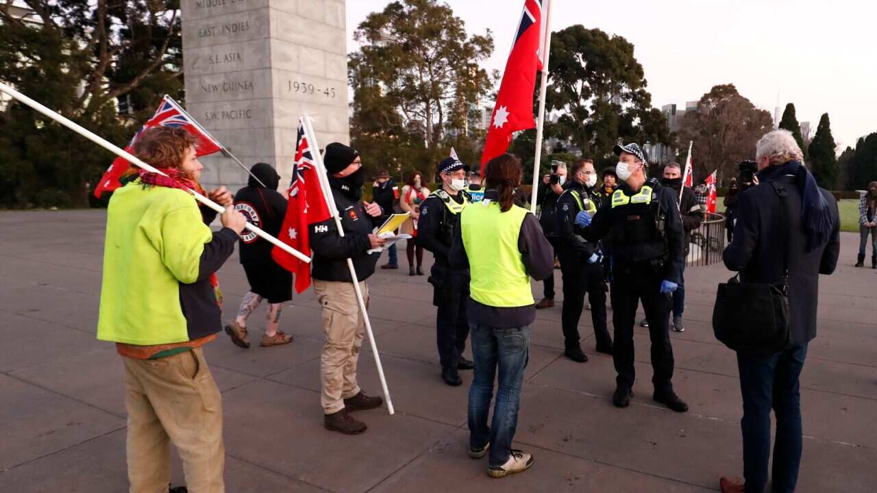 Victoria Police move on Members of a group calling themselves the United Kingdom of Australia at the Shrine of Remembrance on July 31, 2020 in Melbourne.