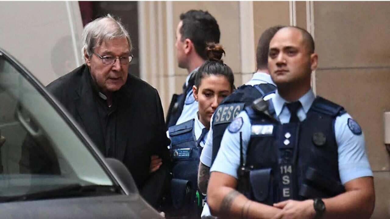 Cardinal George Pell arrives to court