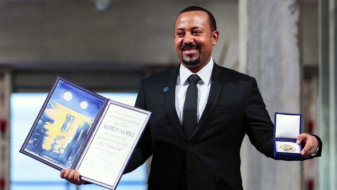 Ethiopia's Prime Minister Abiy Ahmed poses for the media after receiving the Nobel Peace Prize during the award ceremony in Oslo City Hall, Norway, Tuesday Dec. 10, 2019. (HÃ¥kon Mosvold Larsen/NTB Scanpix via AP)