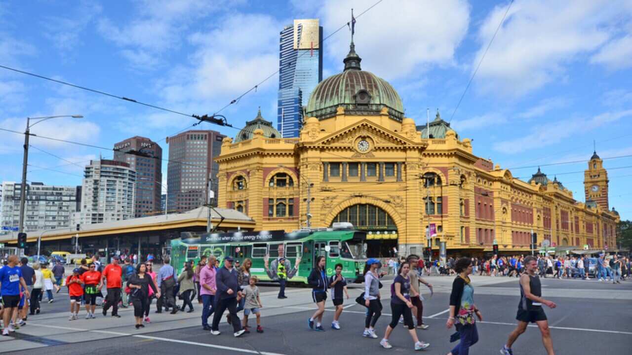 Pedestrians cross Flinders Street towards Flinders Street railway stationIts on of the most busiest pedestrian crossings in Australia and the busiest of Melbourne, Australia. (Photo by: Avalon/UIG via Getty Images)