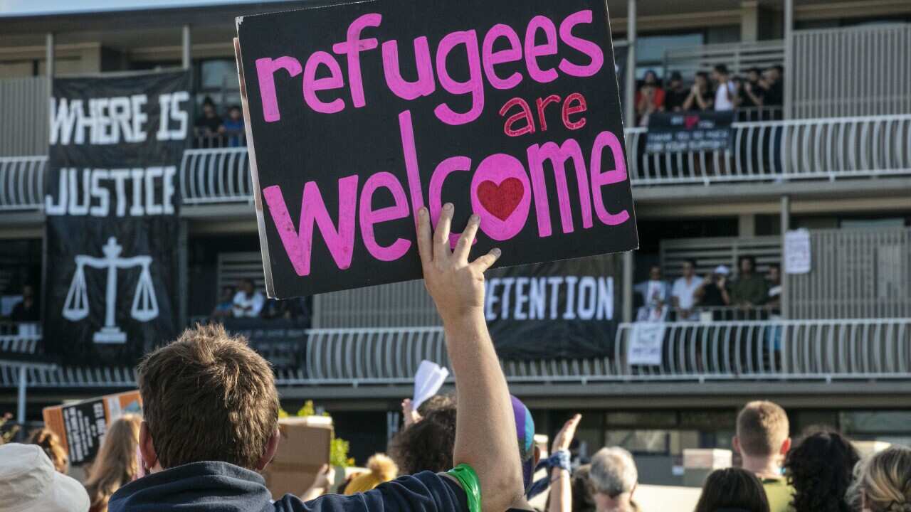 Protesters gather to support asylum seekers detained at Brisbane's Kangaroo Point Central Hotel in June.