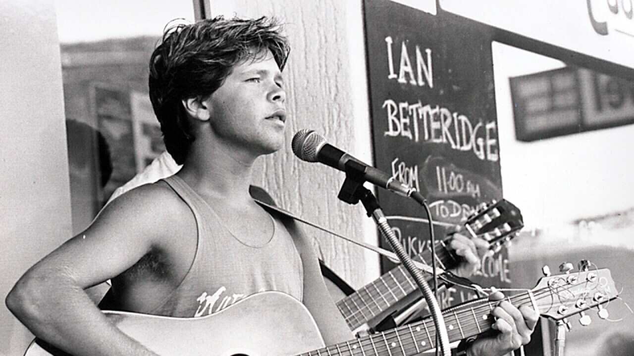 A young Troy Cassar-Daley busks in Tamworth