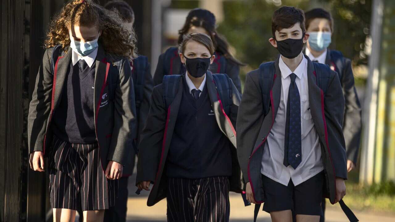 Bentleigh Secondary College students are seen returning to school as COVID-19 restrictions are eased across Victoria, in Melbourne, Wednesday, July 28, 2021.  (AAP Image/Daniel Pockett) NO ARCHIVING