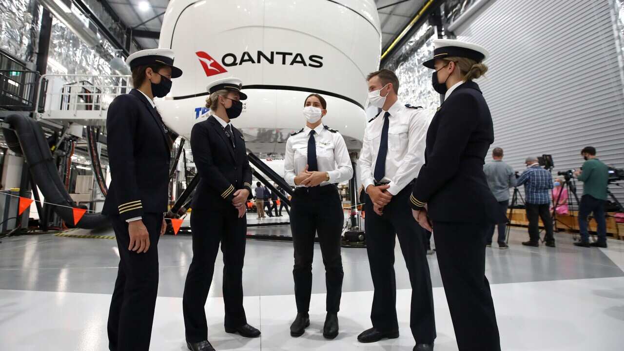 Pilots speak during the official opening of the new Qantas Flight Training Centre in Brisbane