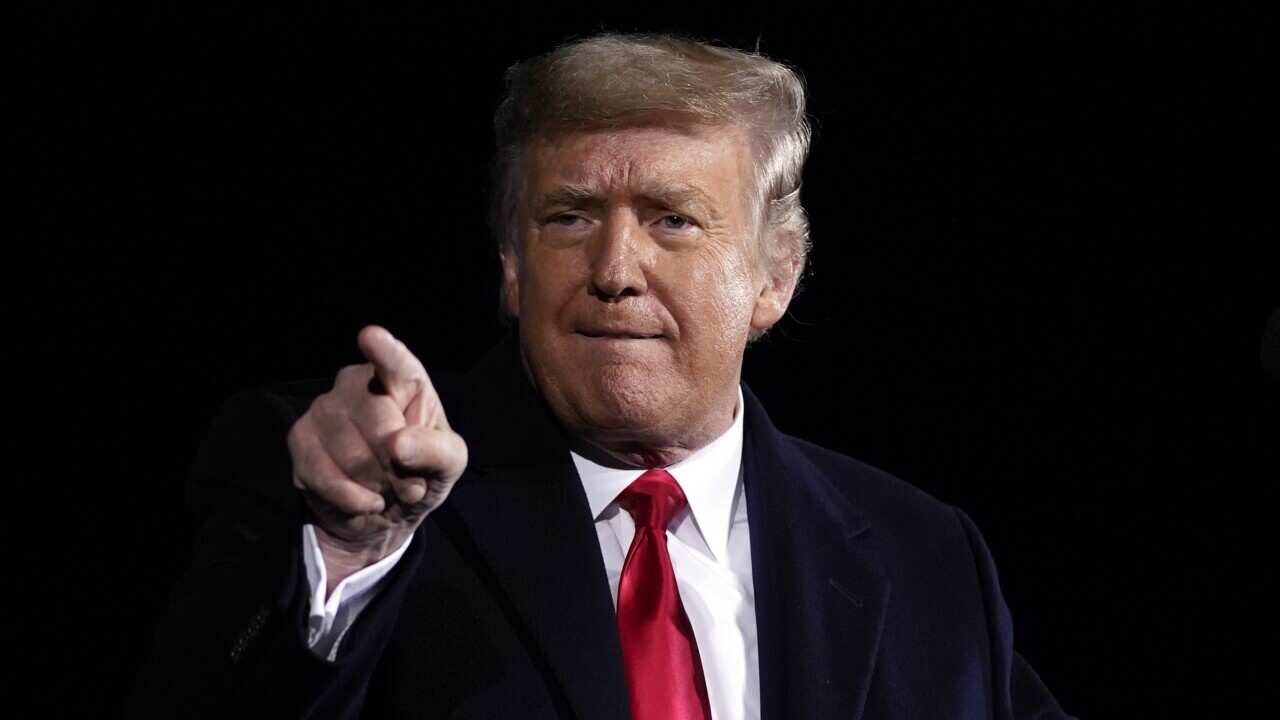 Donald Trump speaks during a campaign rally for Sen. Kelly Loeffler, R-Ga., and David Perdue at Dalton Regional Airport, Monday, Jan. 4, 2021, in Dalton, Ga. (AP Photo/Evan Vucci)