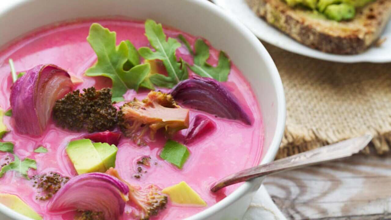 Pink soup with roasted onions and broccoli