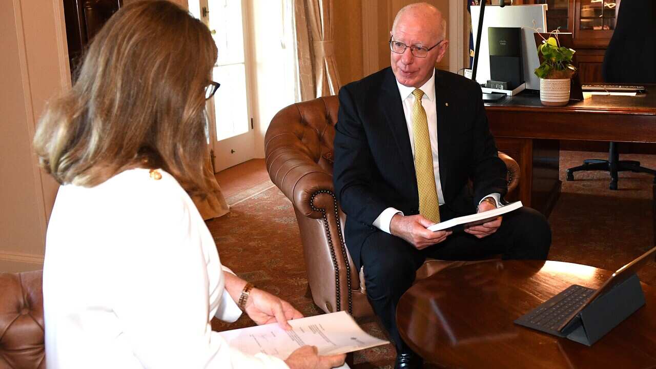 Governor General David Hurley recieves the final report of The Royal Commission into Aged Care from Commisioner Lynelle Briggs