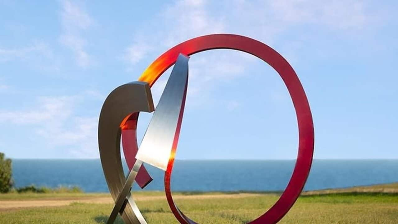 Image of a sculpture at the seaside park with an ocean backdrop.